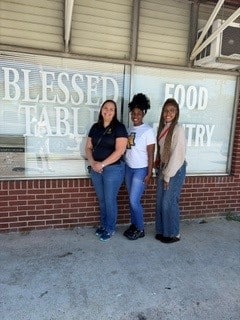Photo of members of the AKD Zeta Chapter at the local Food Pantry.